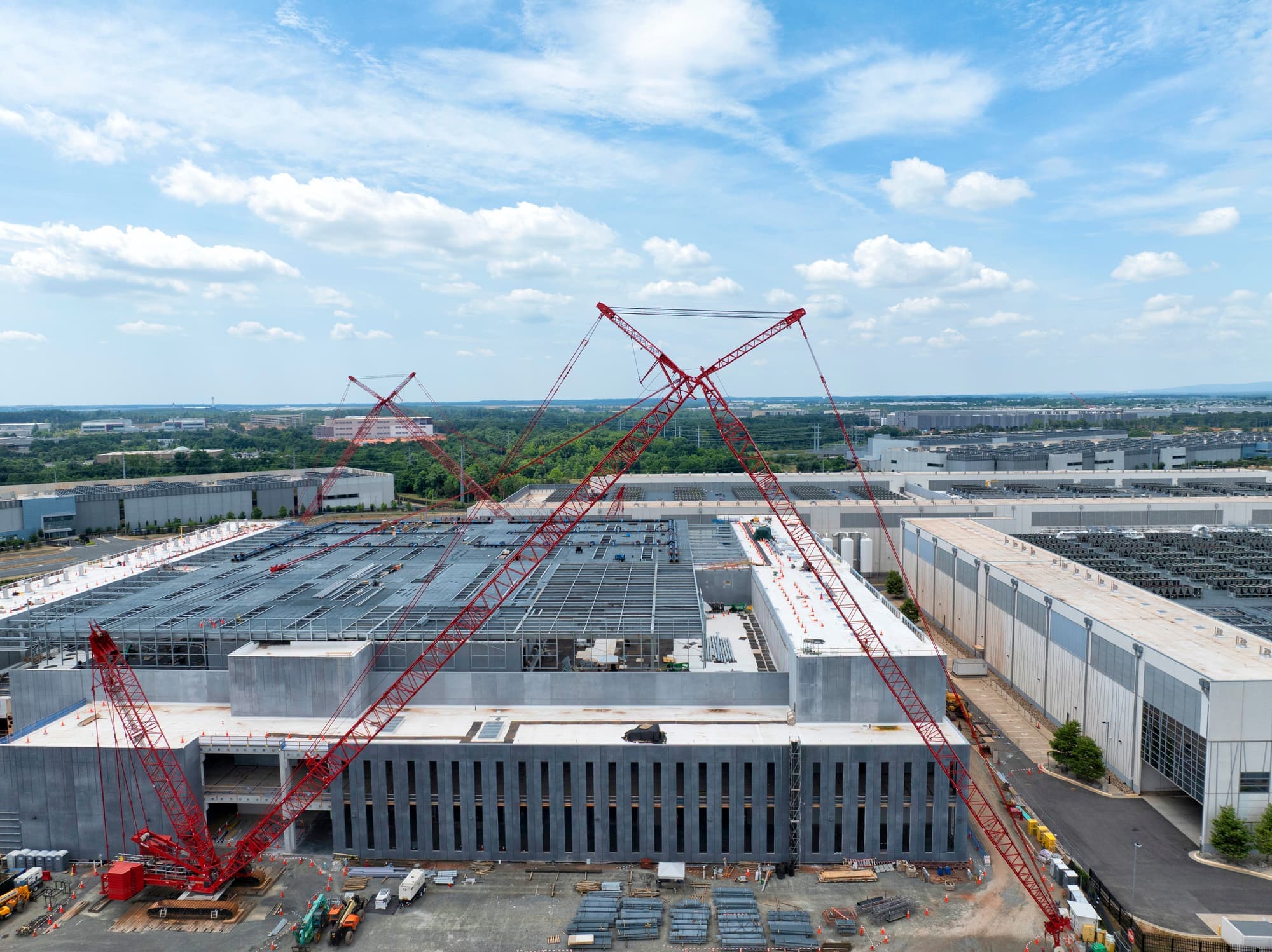 Aerial view of large-scale construction project with cranes